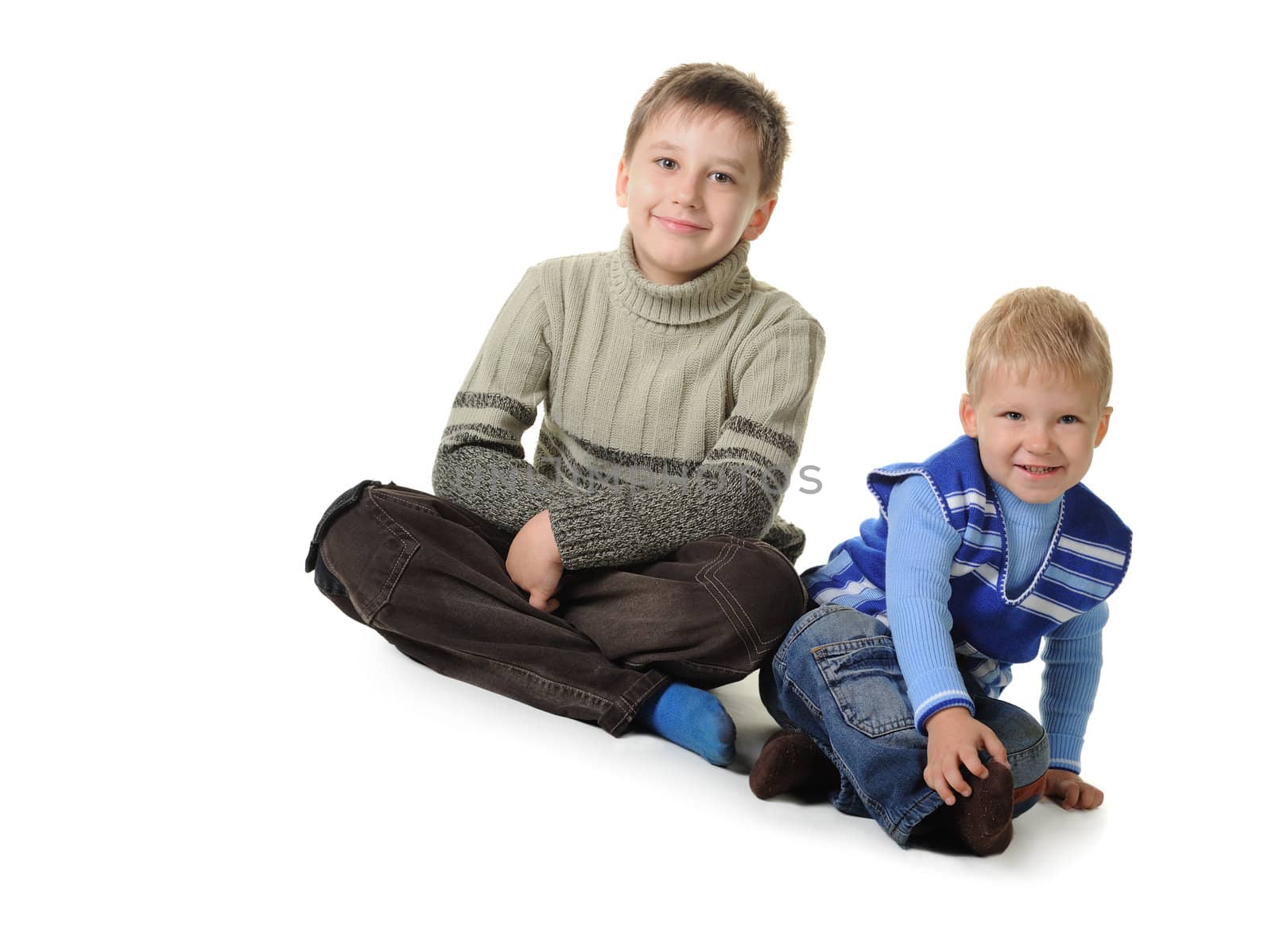 Two brothers. Age of 3 and 7 years. It is isolated on a white background