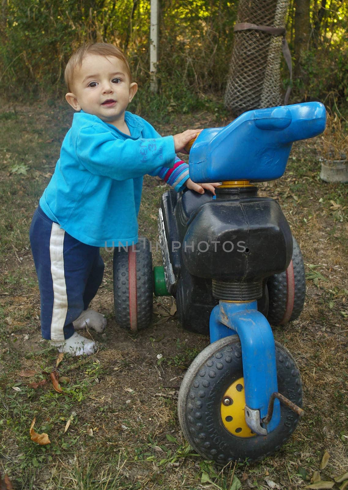 Boy on a motorcycle by sattva