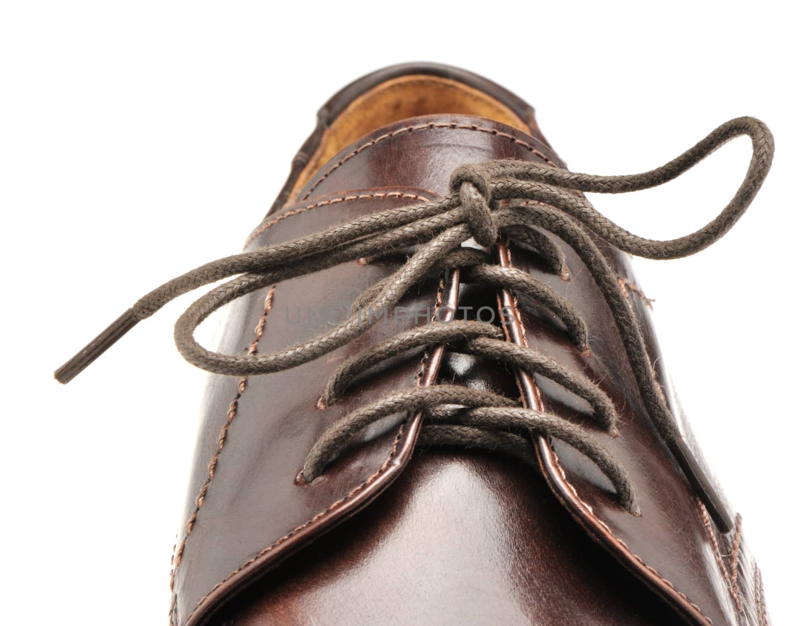 Man's shoes from a brown leather. A photo close up
