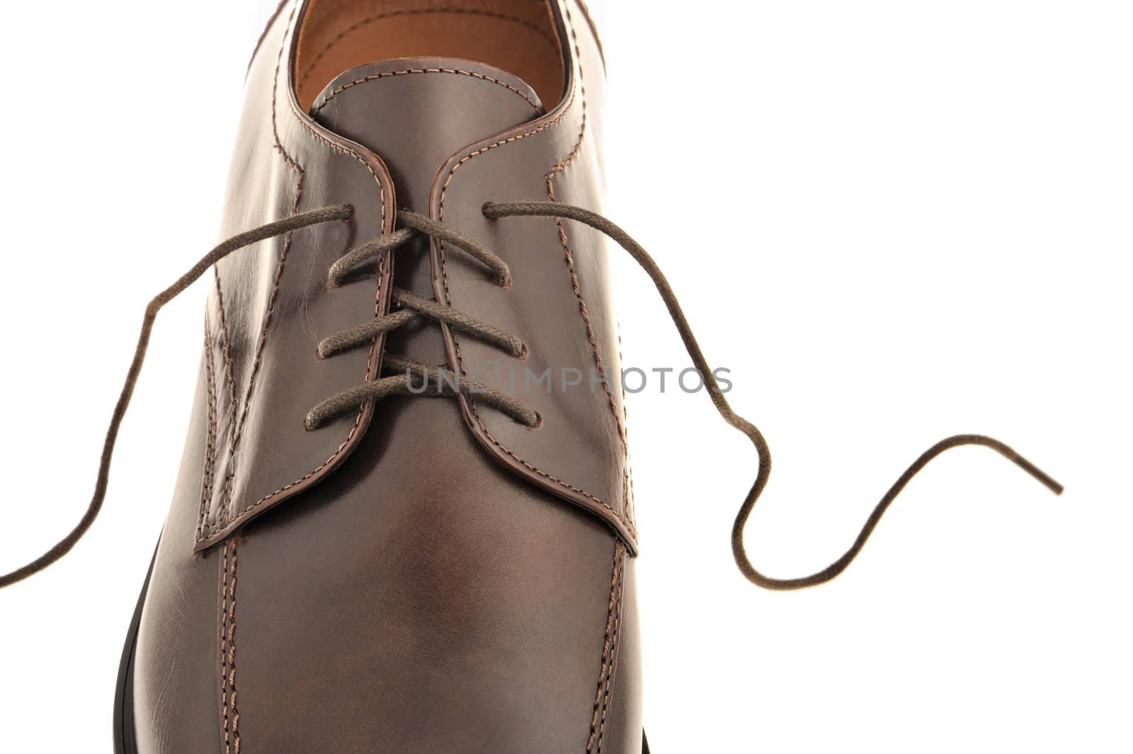 Man's shoes from a brown leather. A photo close up