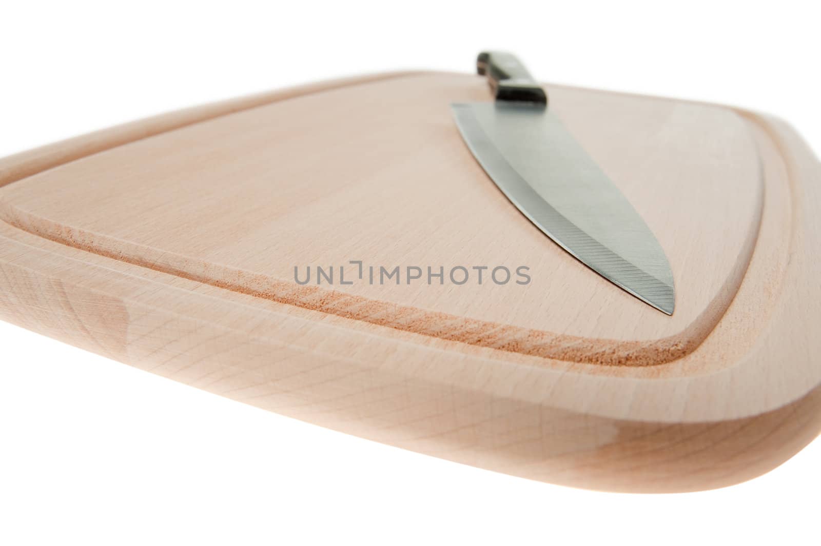 Knife and board for cutting food. Studio shooting.