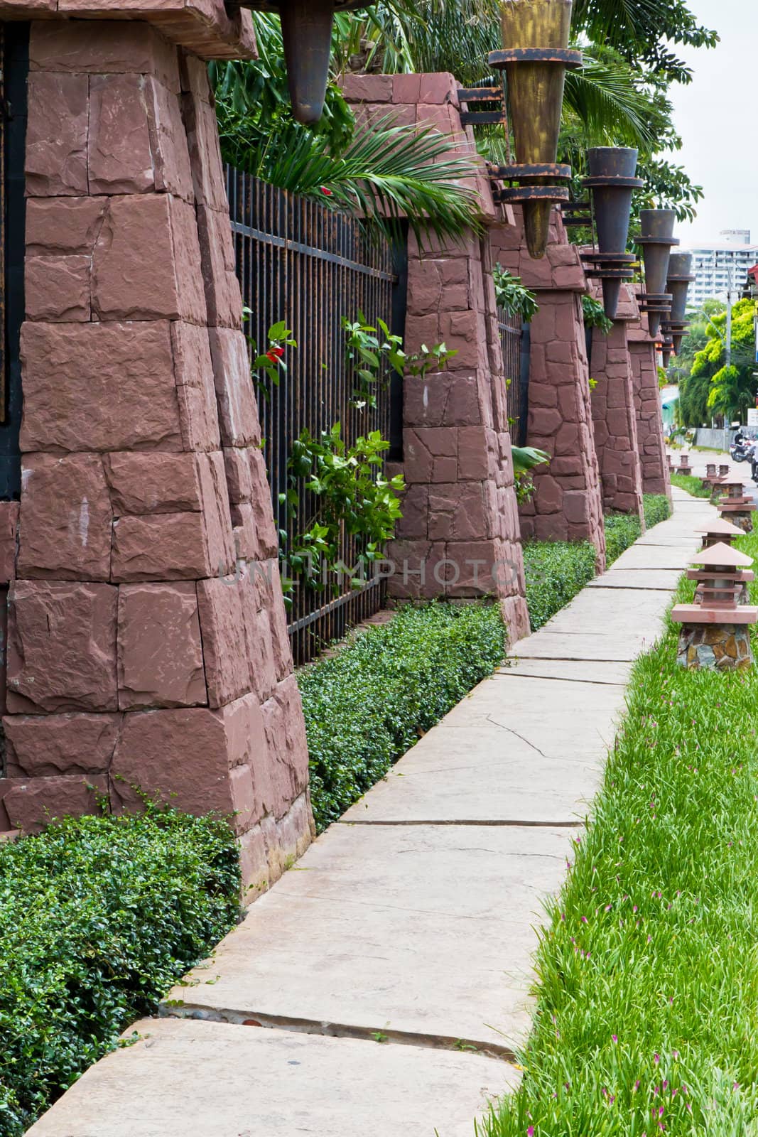 Walkway beside the fence, steel and stone walls of the hotel. by Na8011seeiN