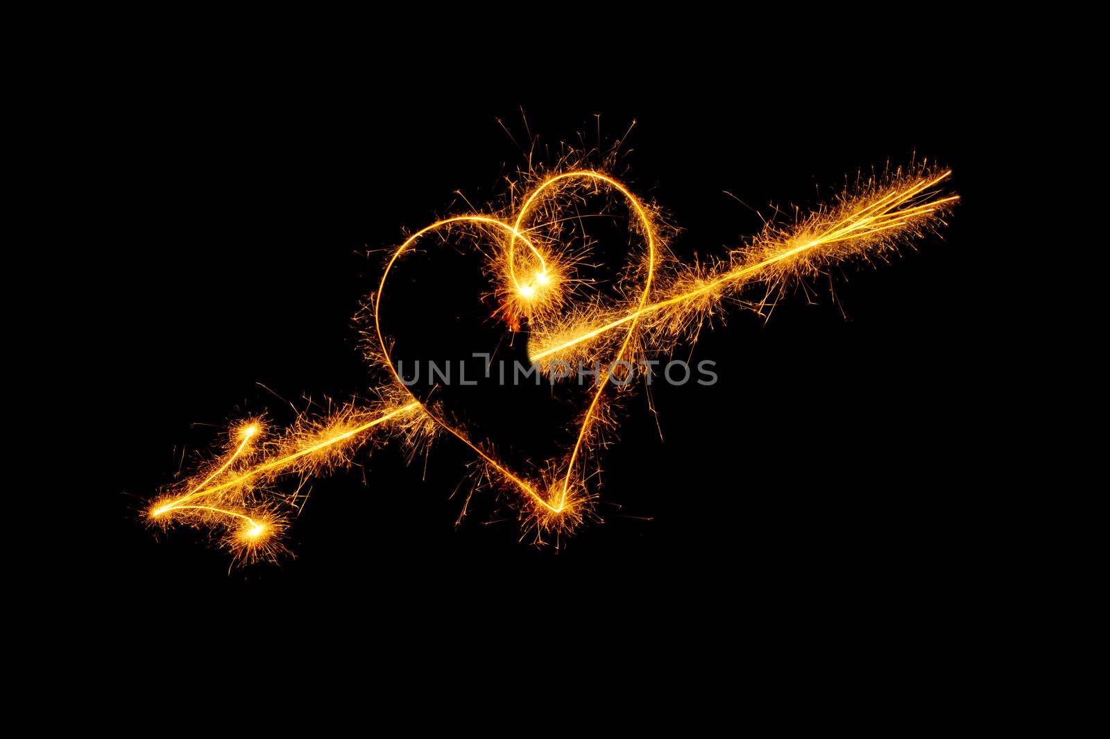 Heart from sparks. It is isolated on a black background