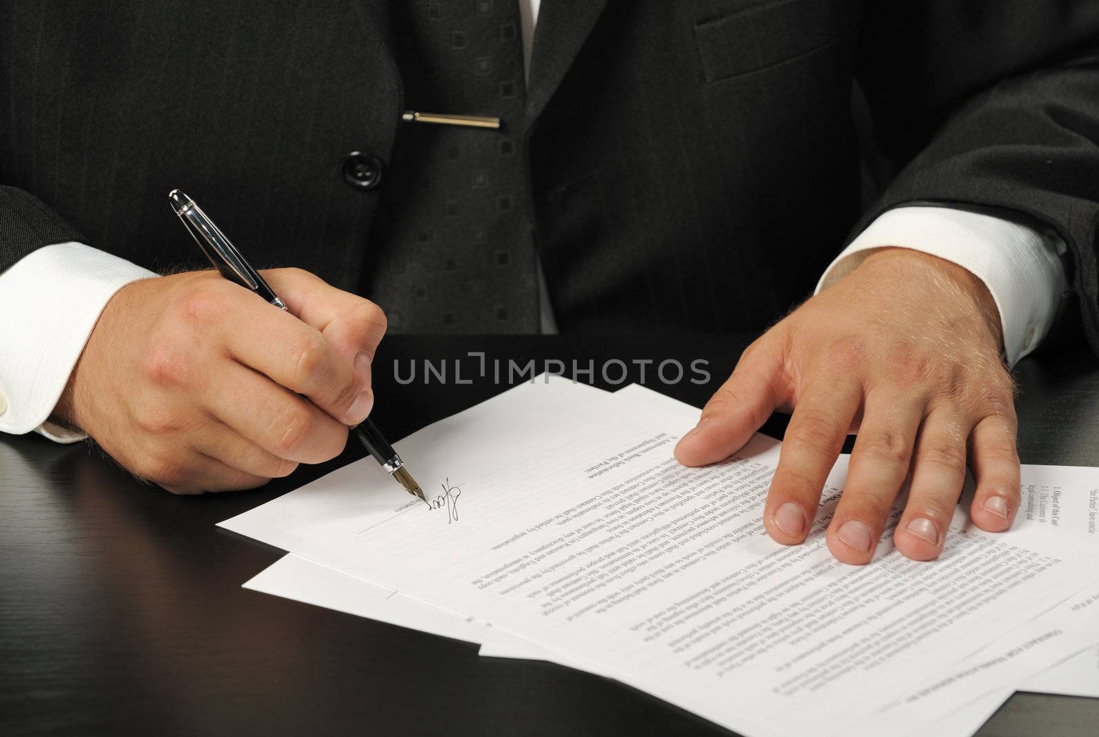 The businessman the signing contract. The man of the European nationality.