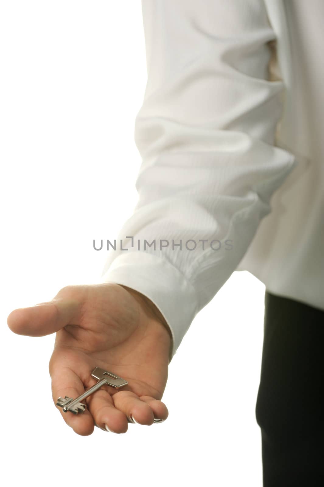 The young businessman with a key in a hand. It is isolated on a white background