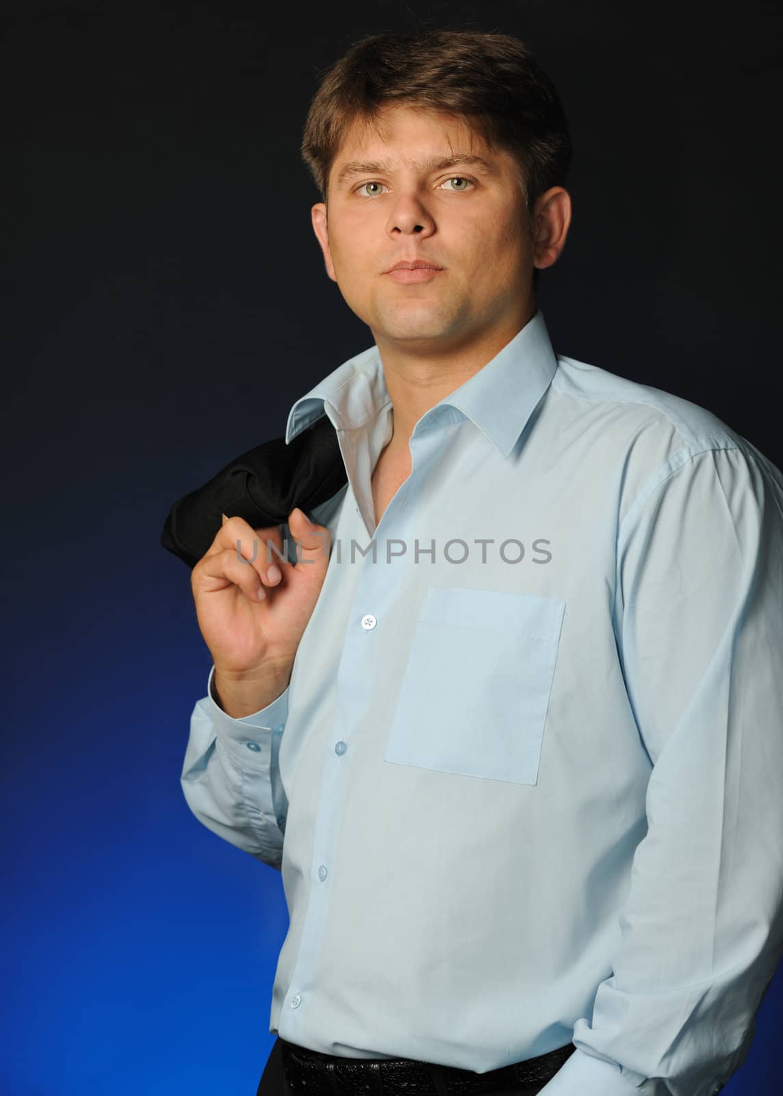 The businessman talking by a mobile phone by galdzer