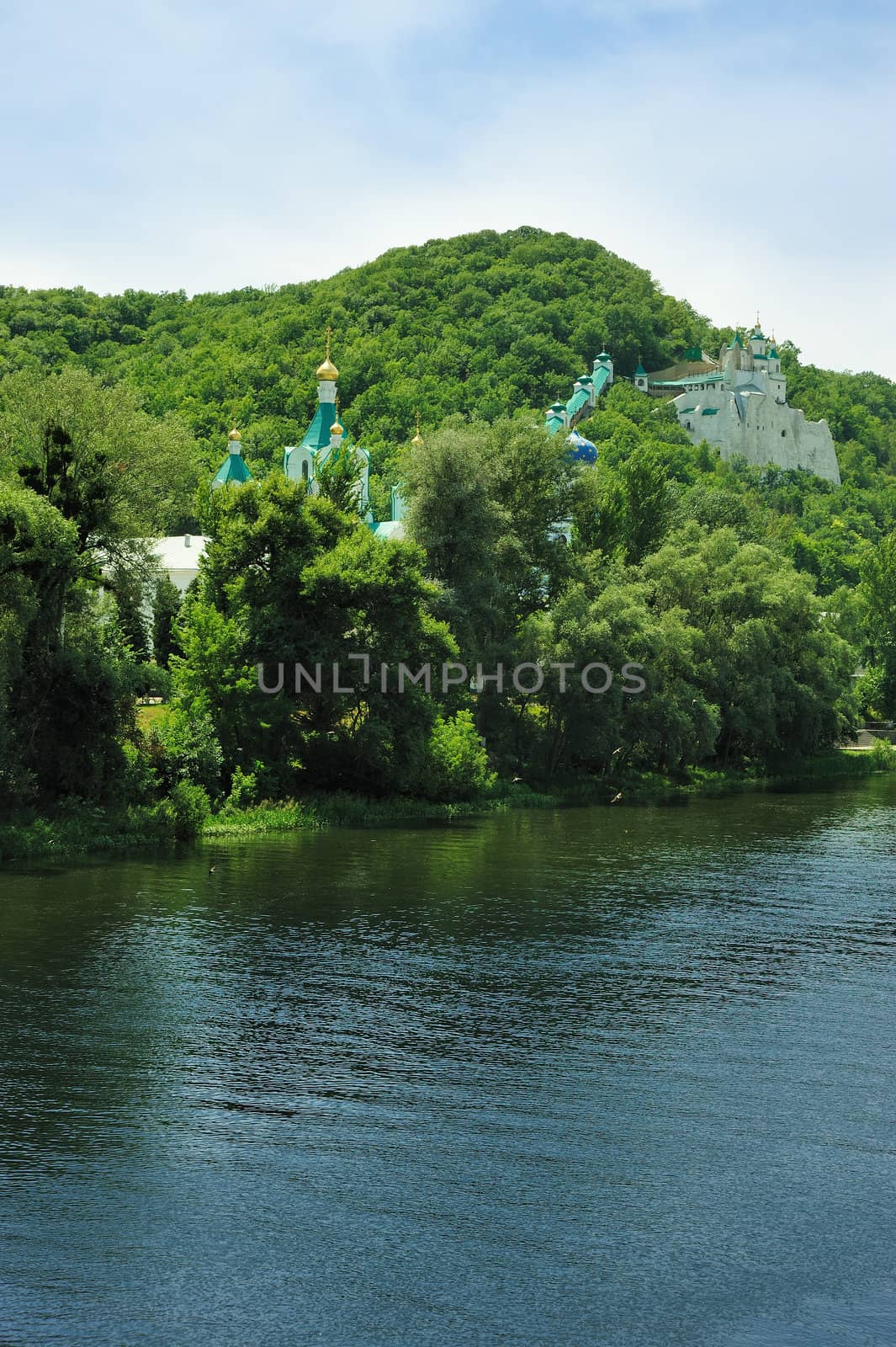 Picturesque forest and the river. Small river at bottom of mountain with mixed by a wood in the East Europe. Ukraine.