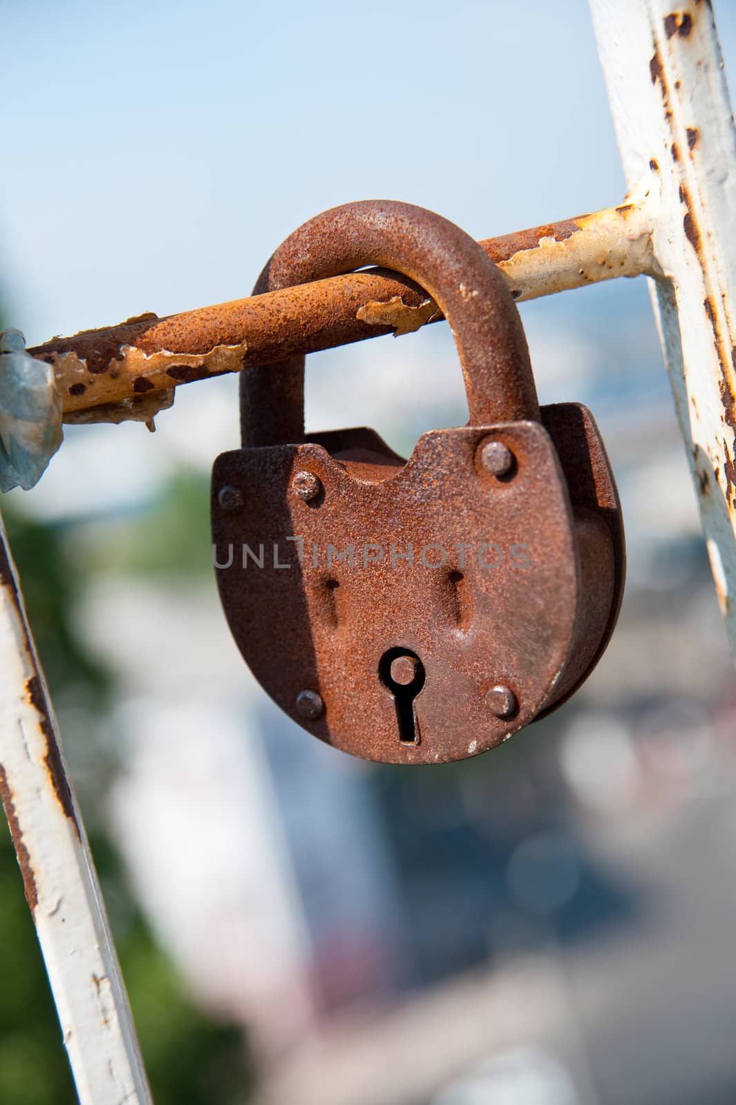 Old padlock. Iron, rusty lock on blur a background