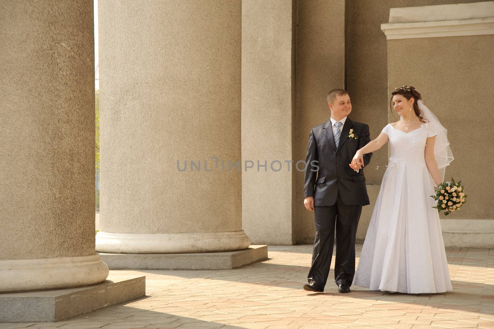 Newly-married couple. Pair young men in wedding day