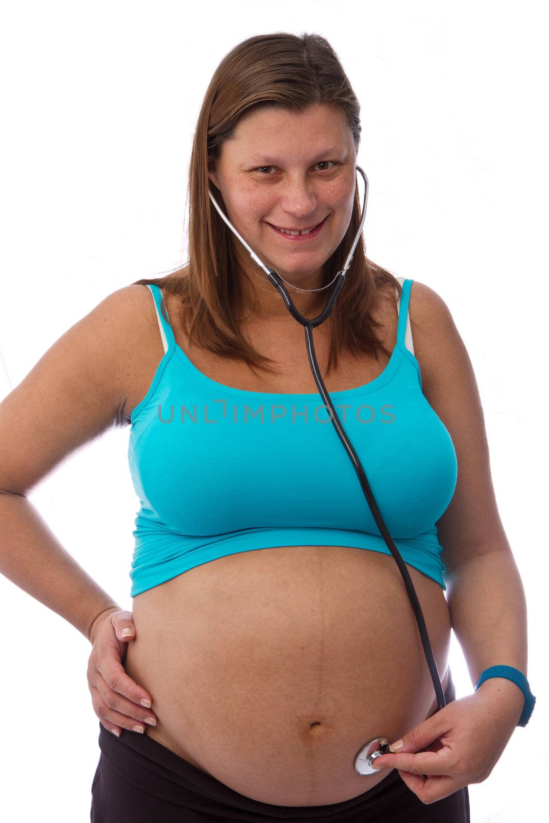Pregnant woman hear with a stethoscope isolated on white