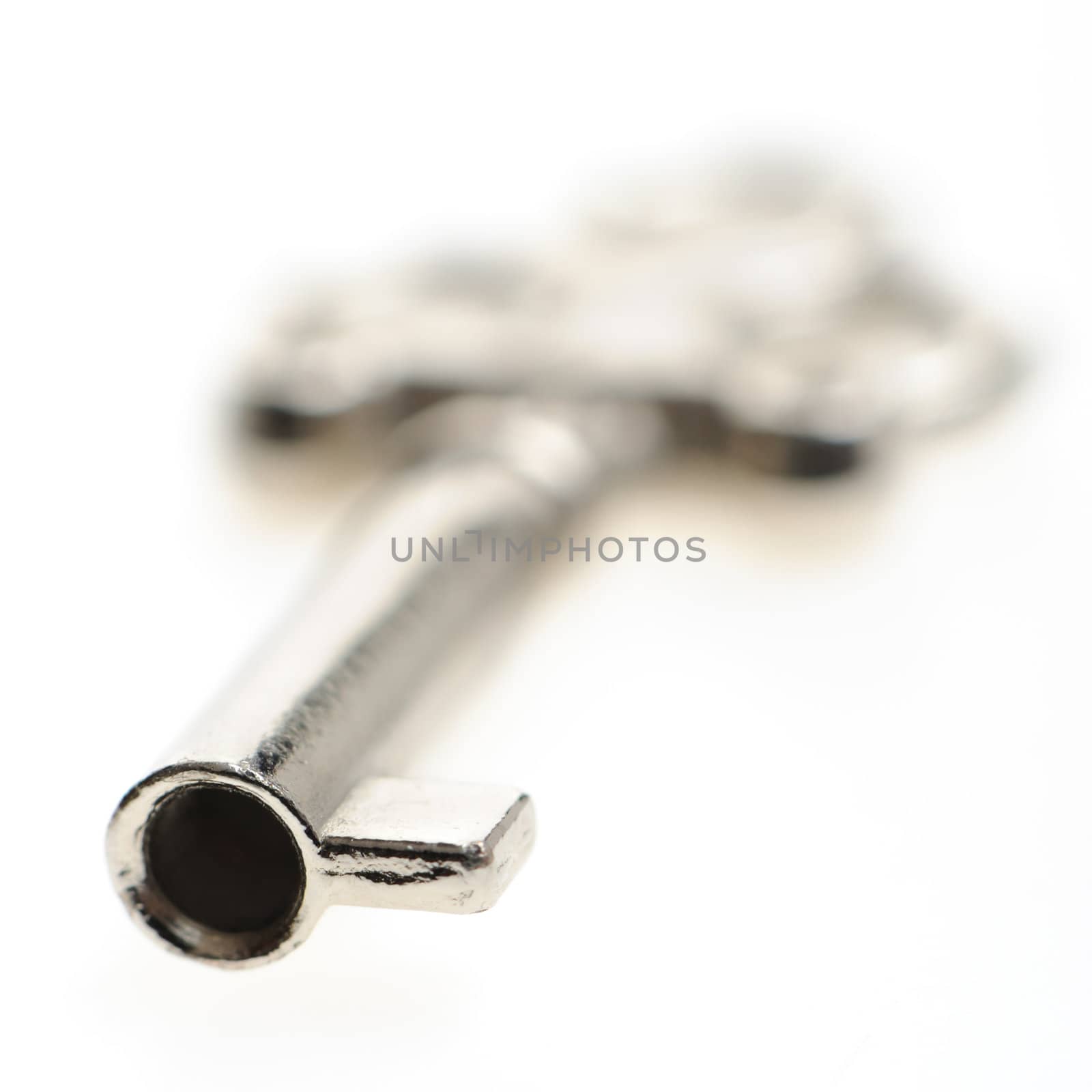 Decorative key. An iron key from the lock isolated on a white background