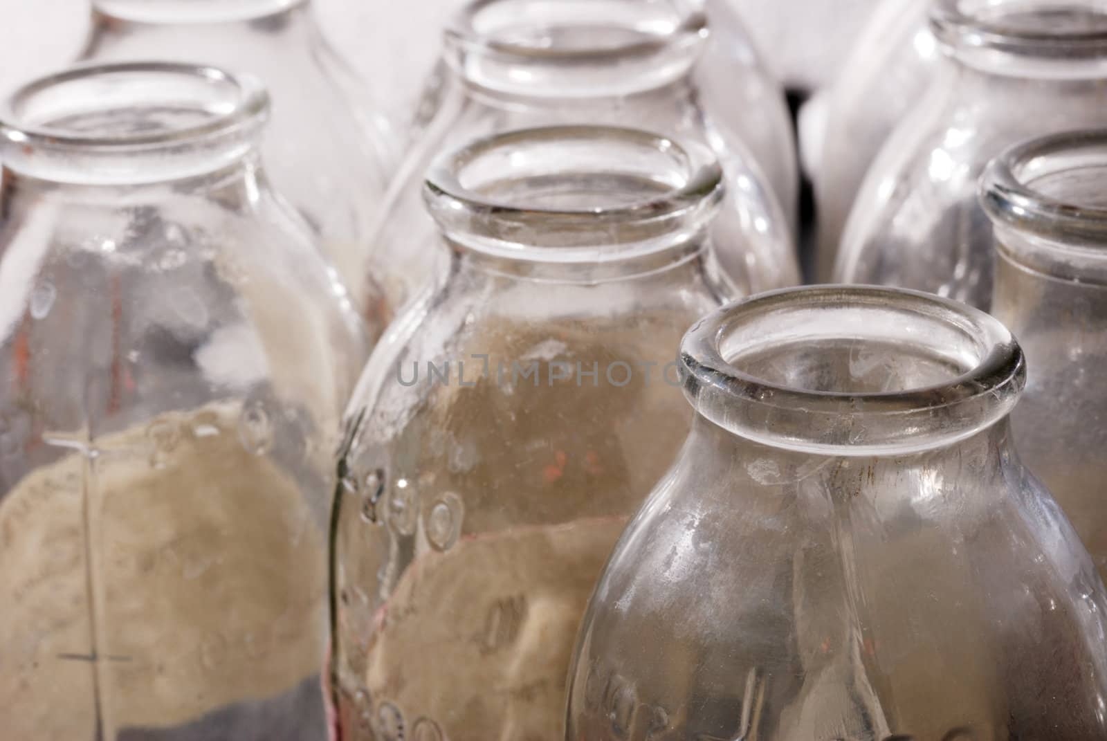Bottles from under milk. Old, dirty prepared for recycling container