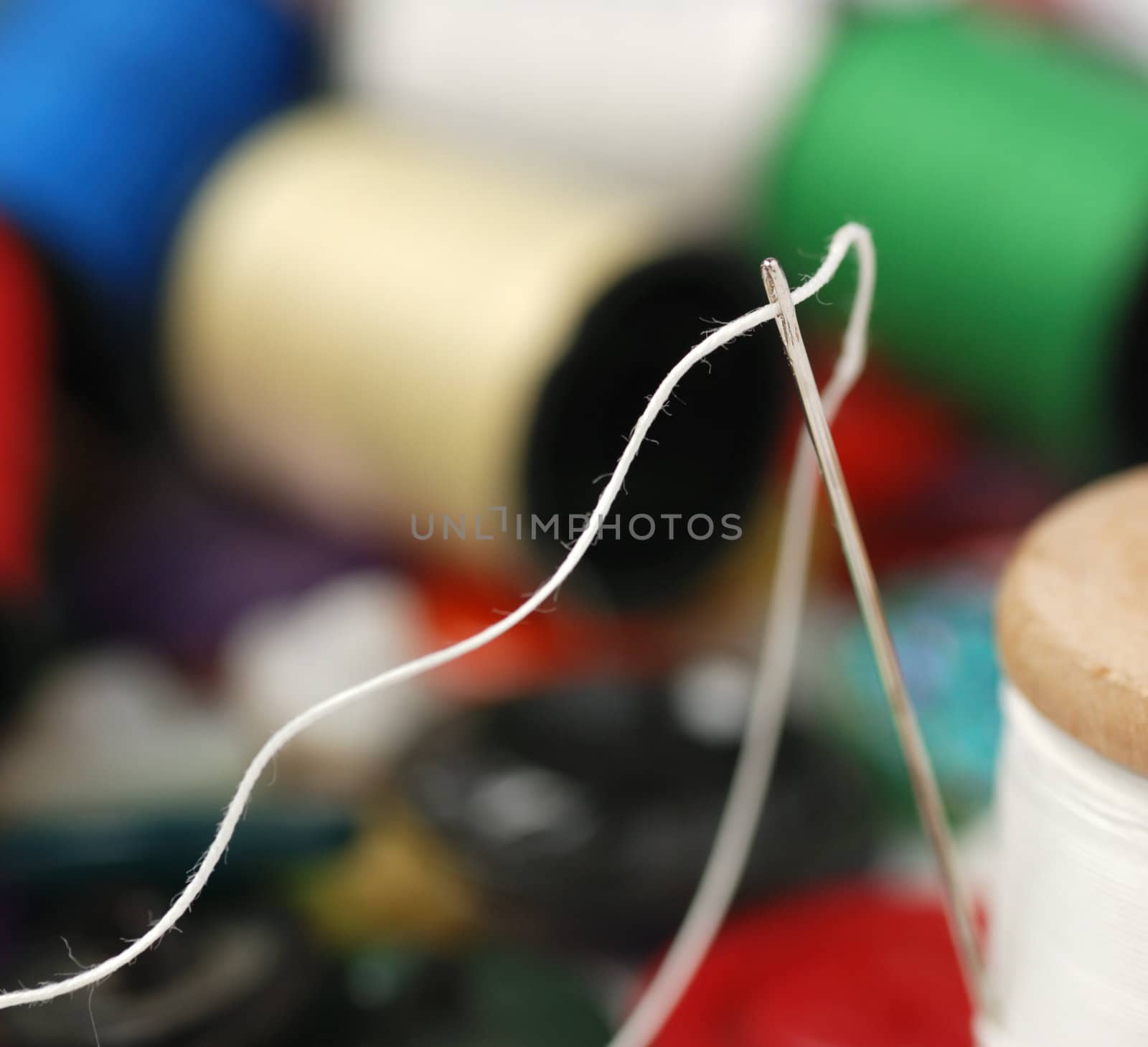 Needle and a thread. A set of accessories for sewing.