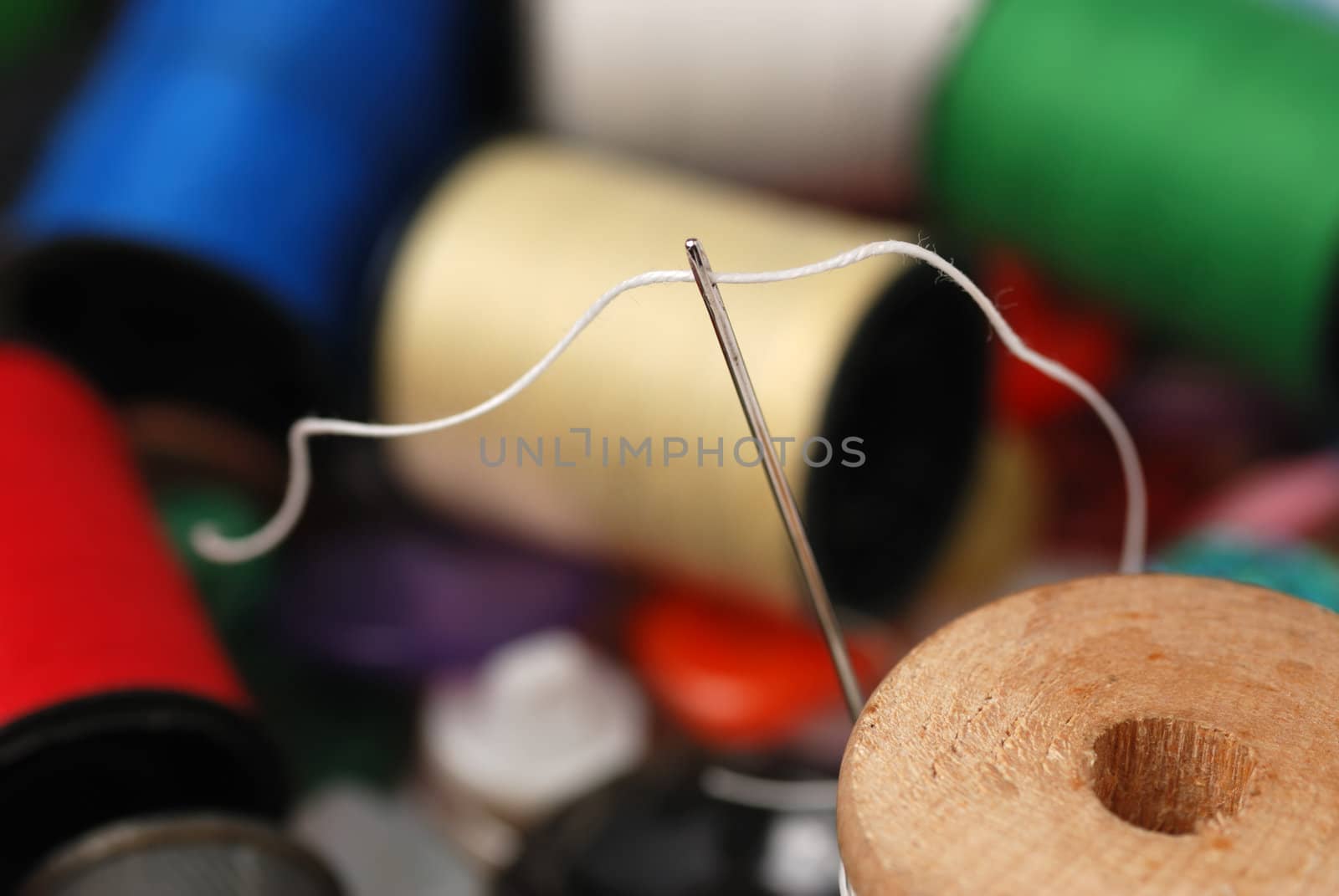 Needle and a thread. A set of accessories for sewing.