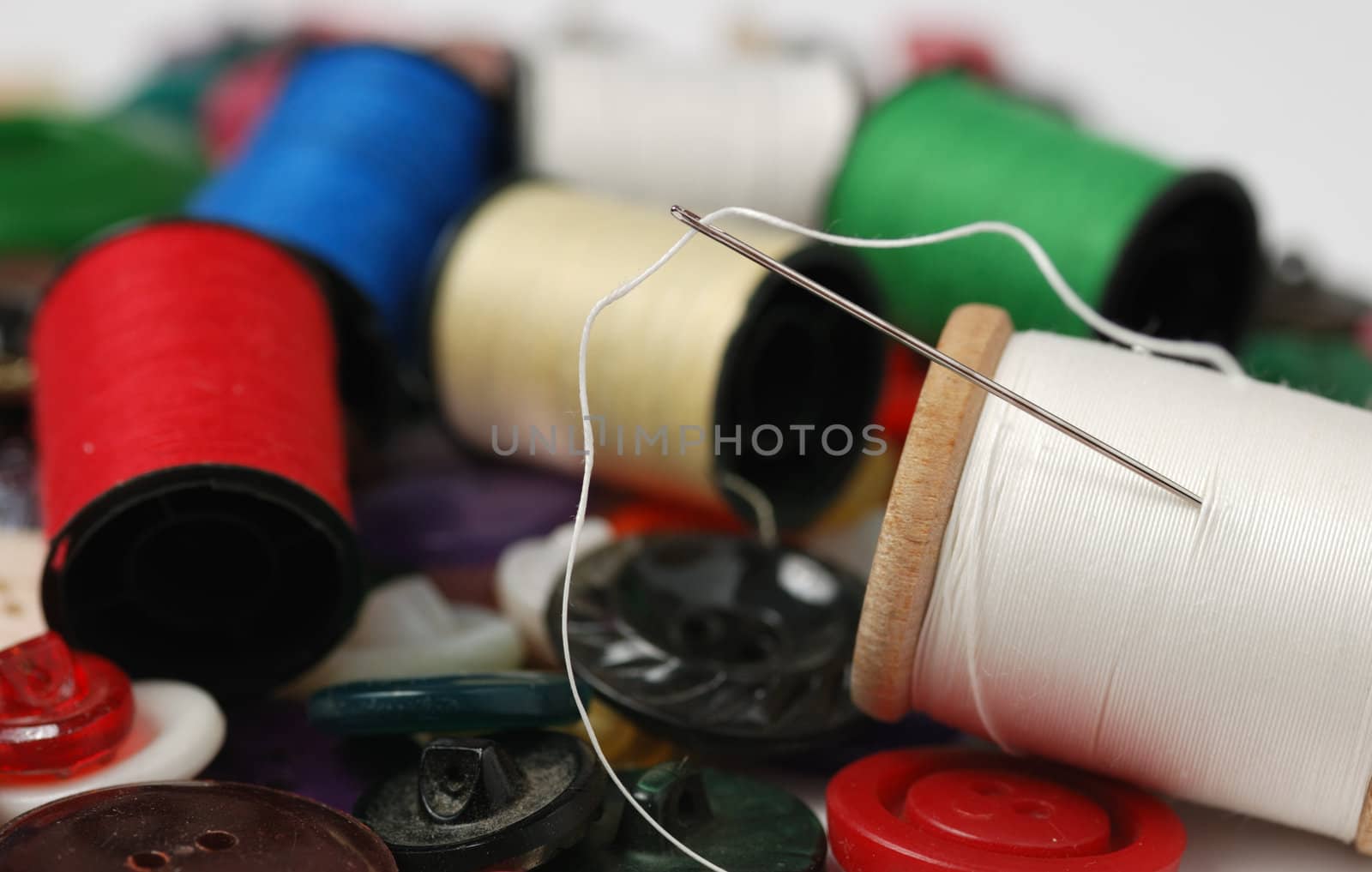 Needle and a thread. A set of accessories for sewing.