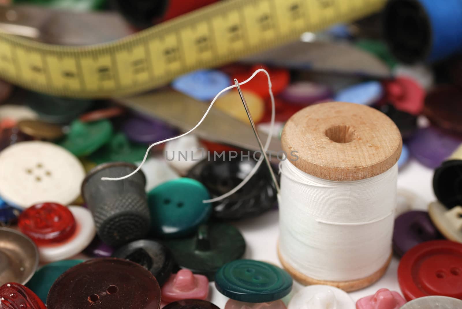 Needle and a thread. A set of accessories for sewing.