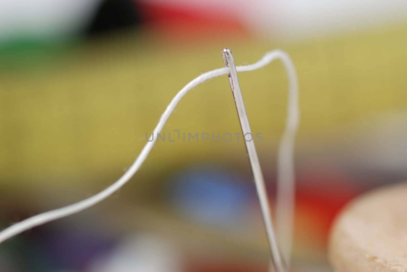 Needle and a thread. A set of accessories for sewing.