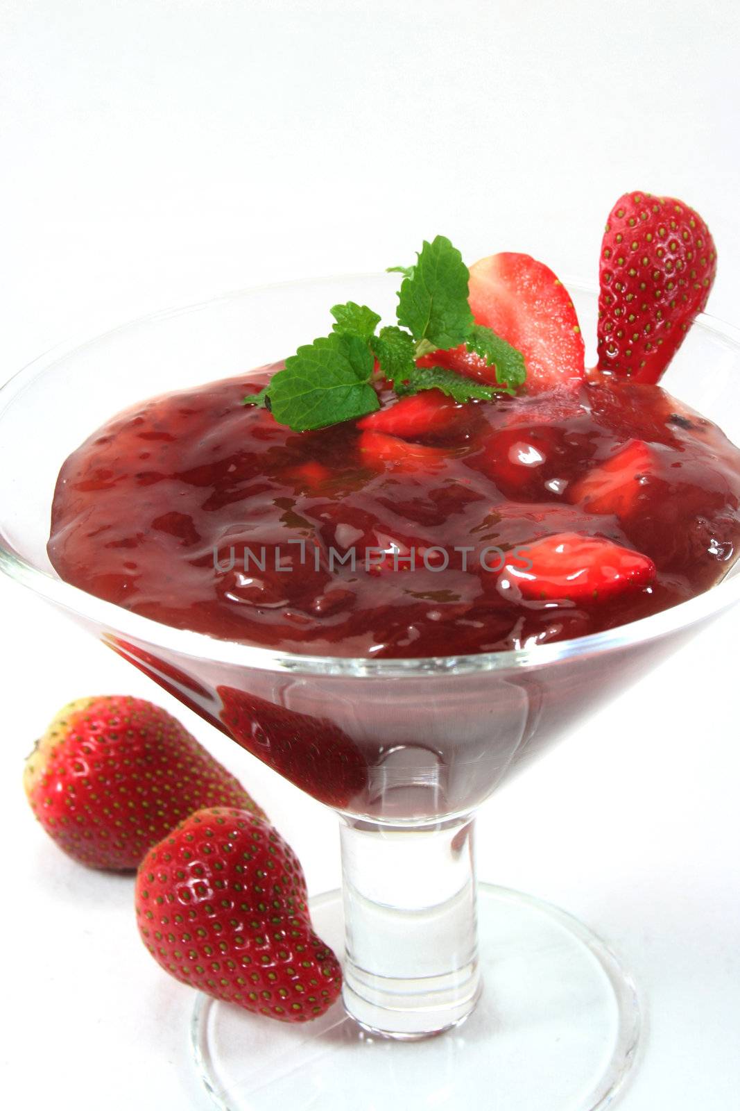 Red fruit jelly with strawberries and lemon balm