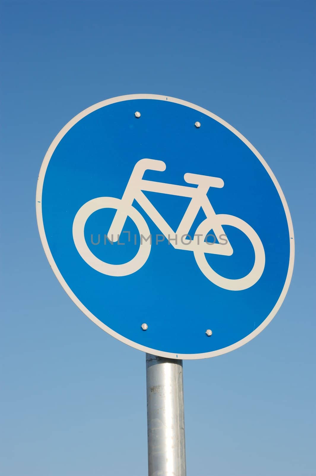 Bicycle road sign against clear blue sky