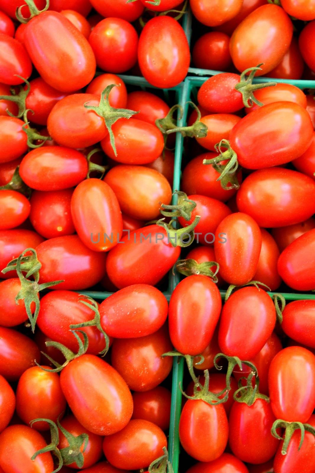 Baskets of red tomatoes at the farmers market