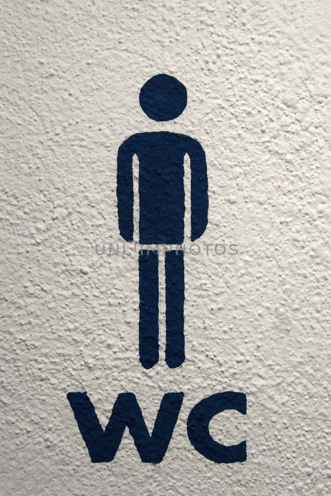 Men's toilet sign on white wall