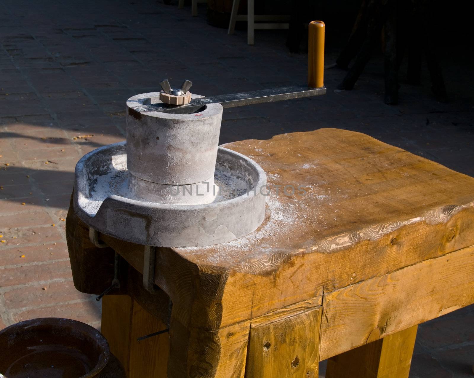 A manual, antique milling machine for gringing wheat