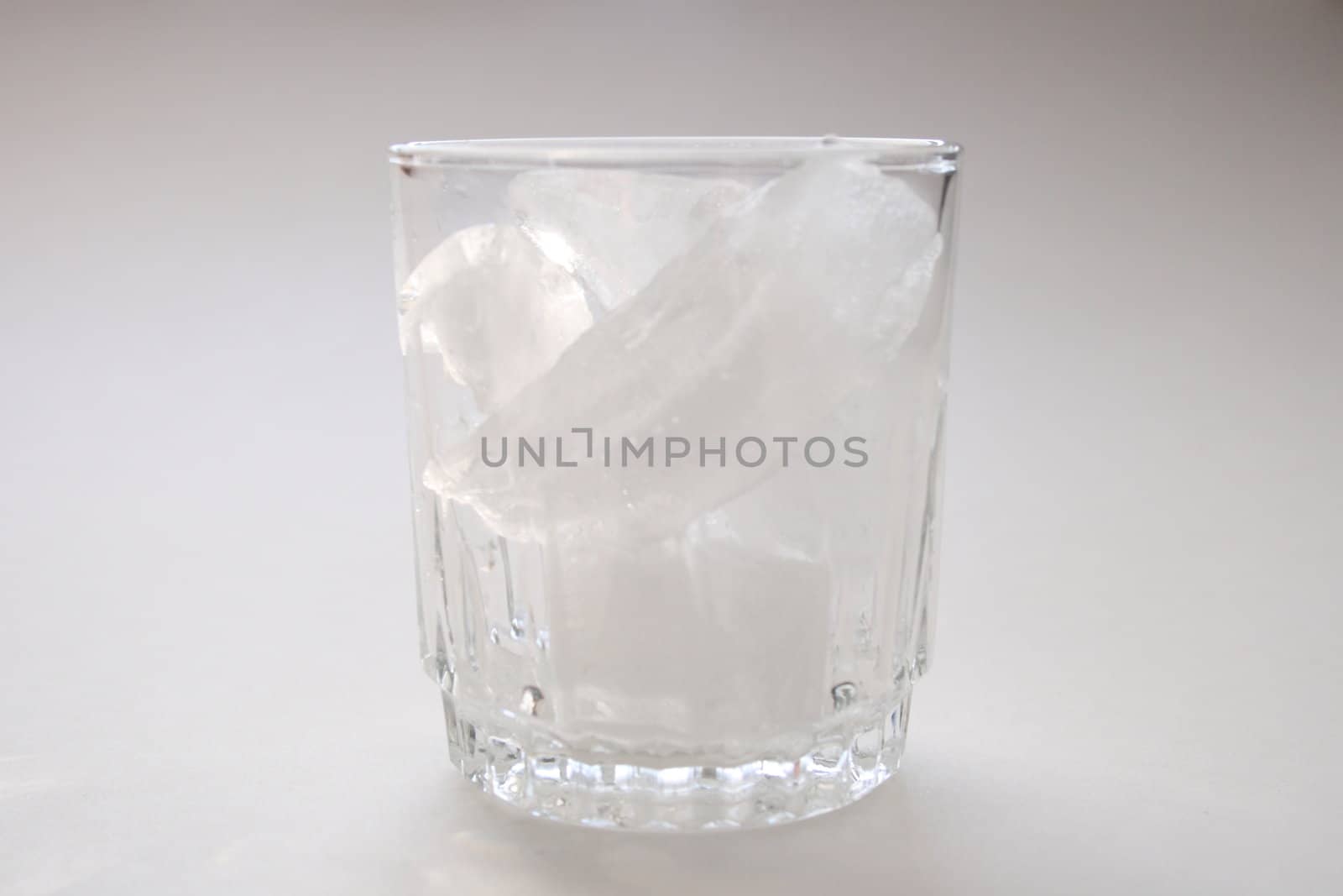 glass full of ice cubes by njene