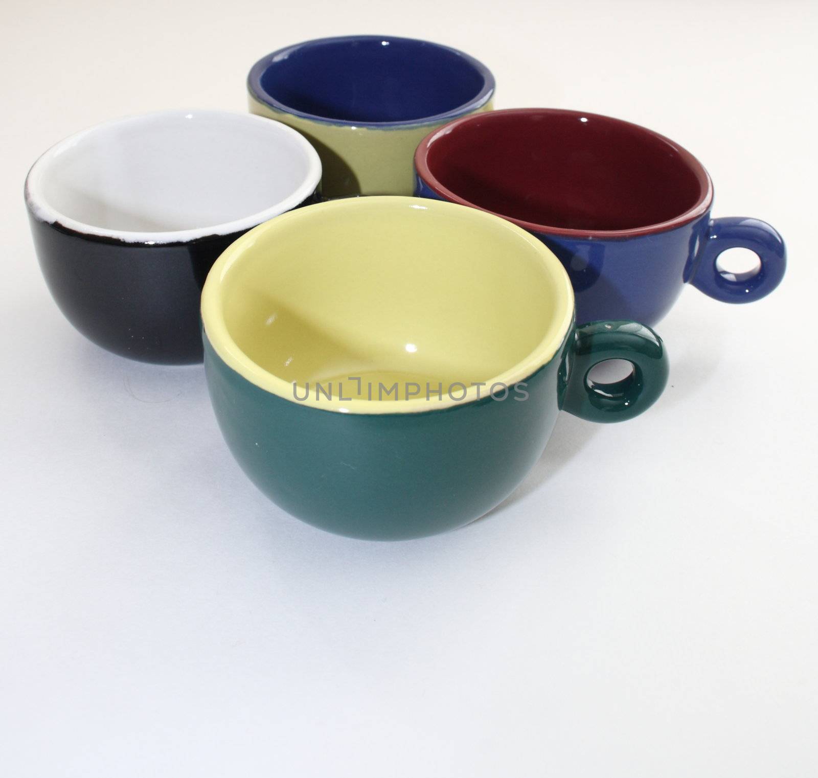 group of colored coffee cups together by njene