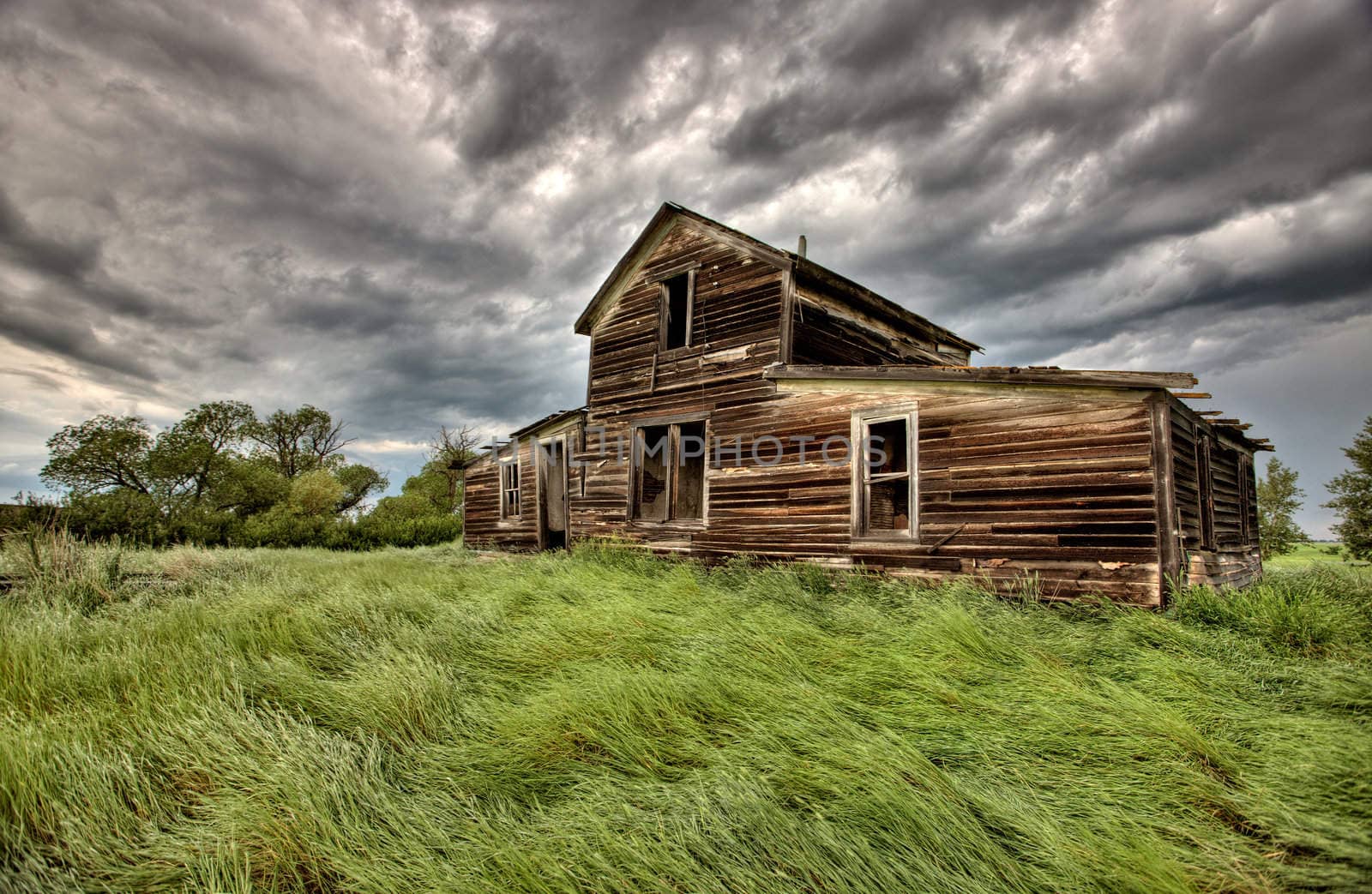 Abandoned Farm Buildings Saskatchewan Canada Storm clouds Prairie