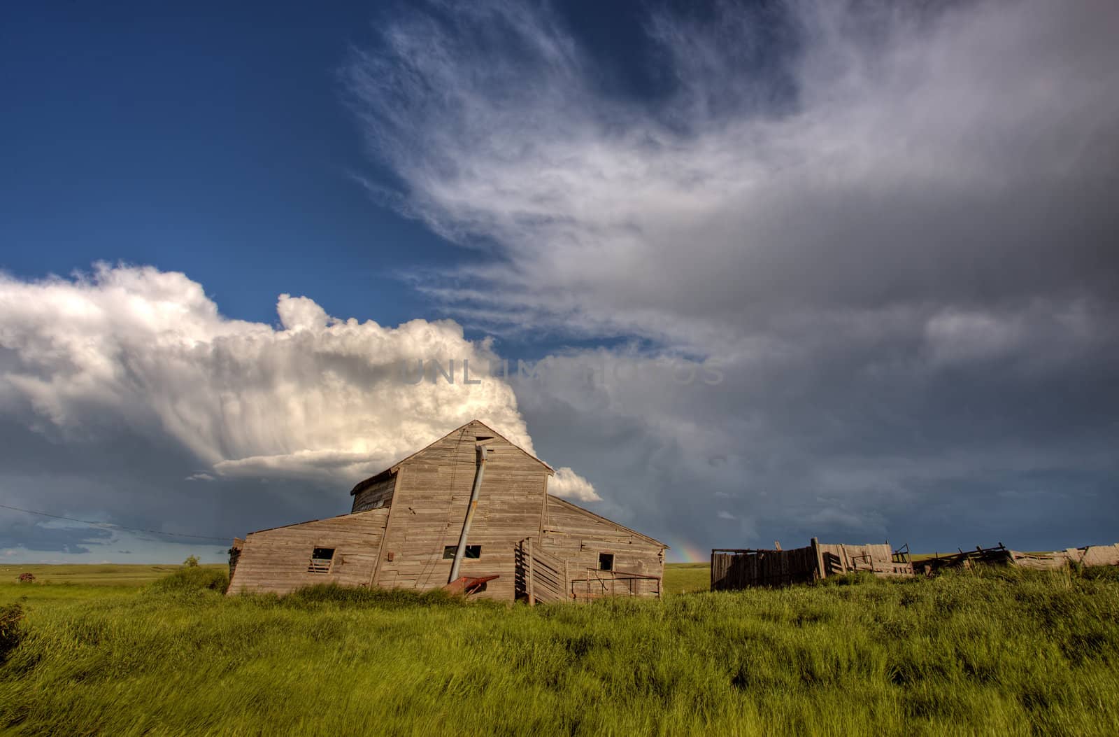 Abandoned Farm Buildings Saskatchewan Canada Storm clouds Prairie