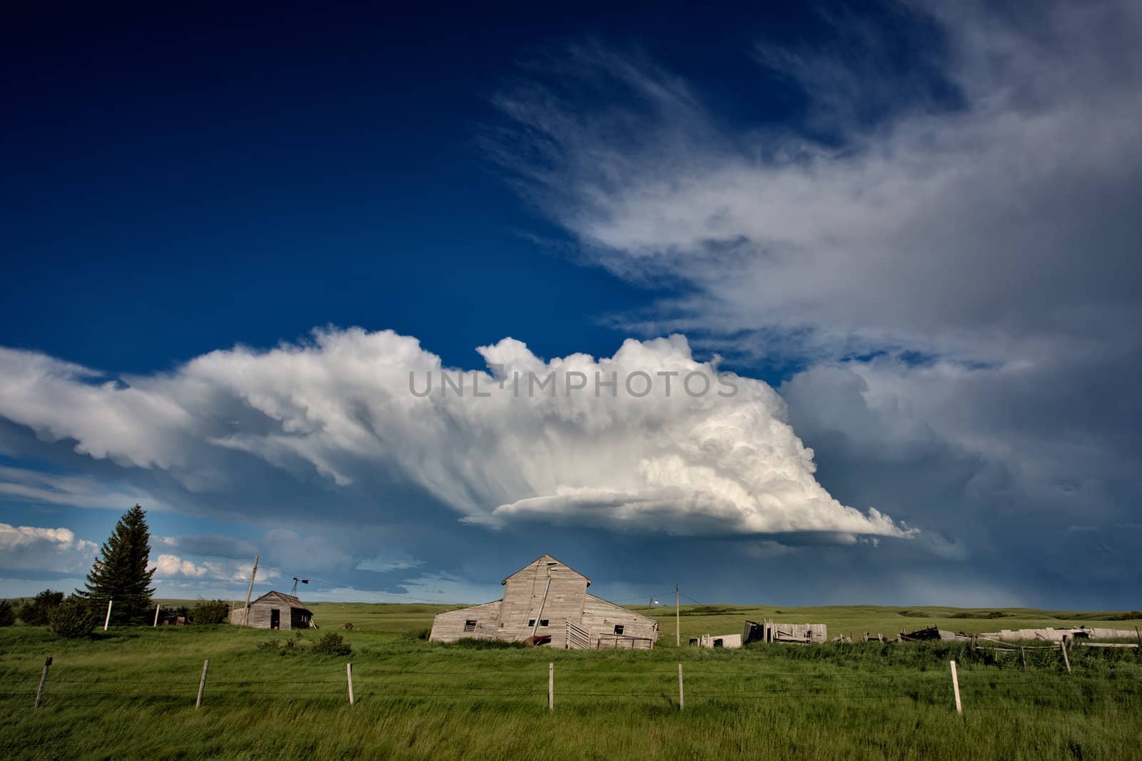 Abandoned Farm Buildings Saskatchewan Canada Storm clouds Prairie