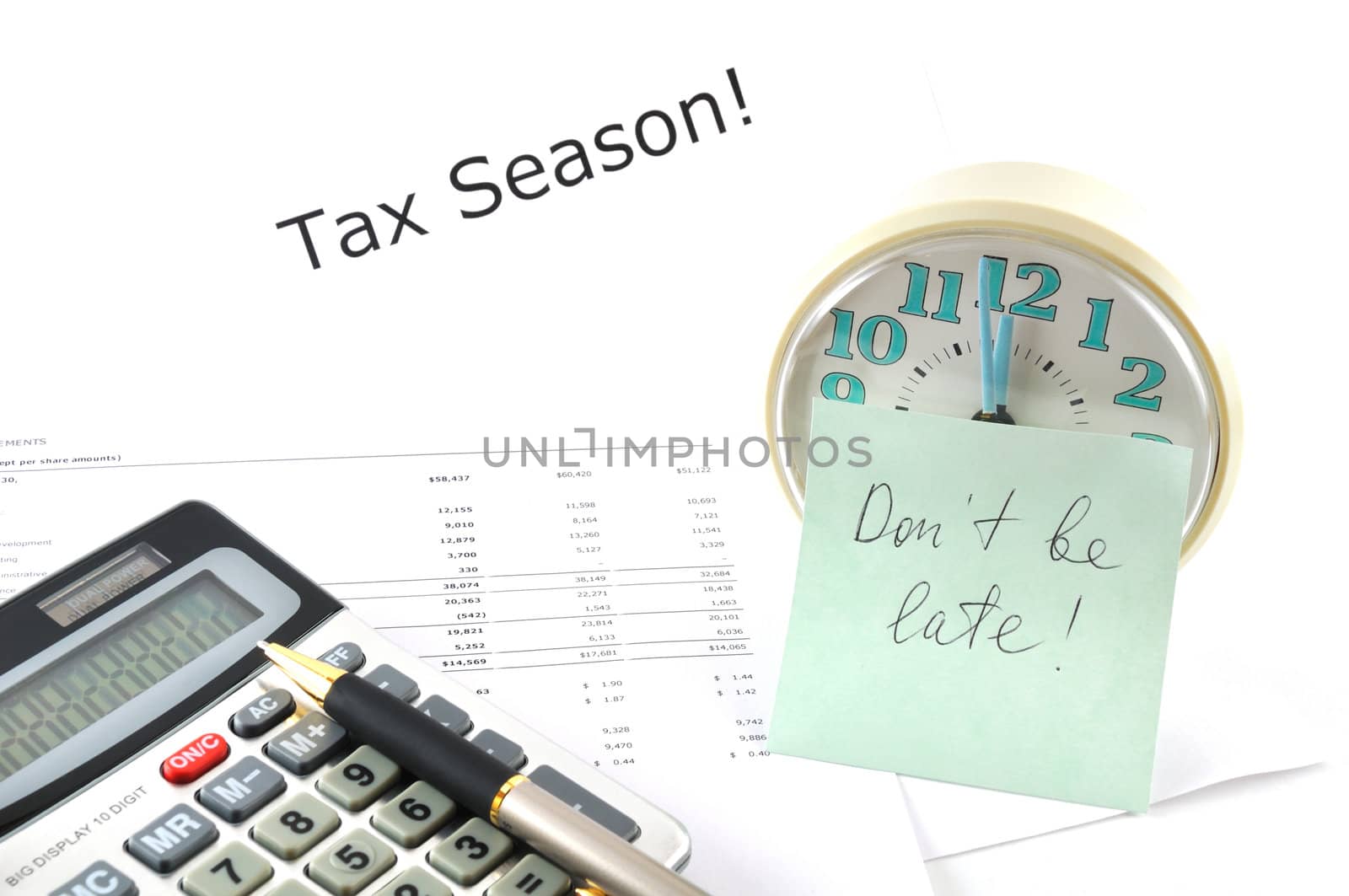 Tax Season!  Concept Image with calculator and clock by lobzik