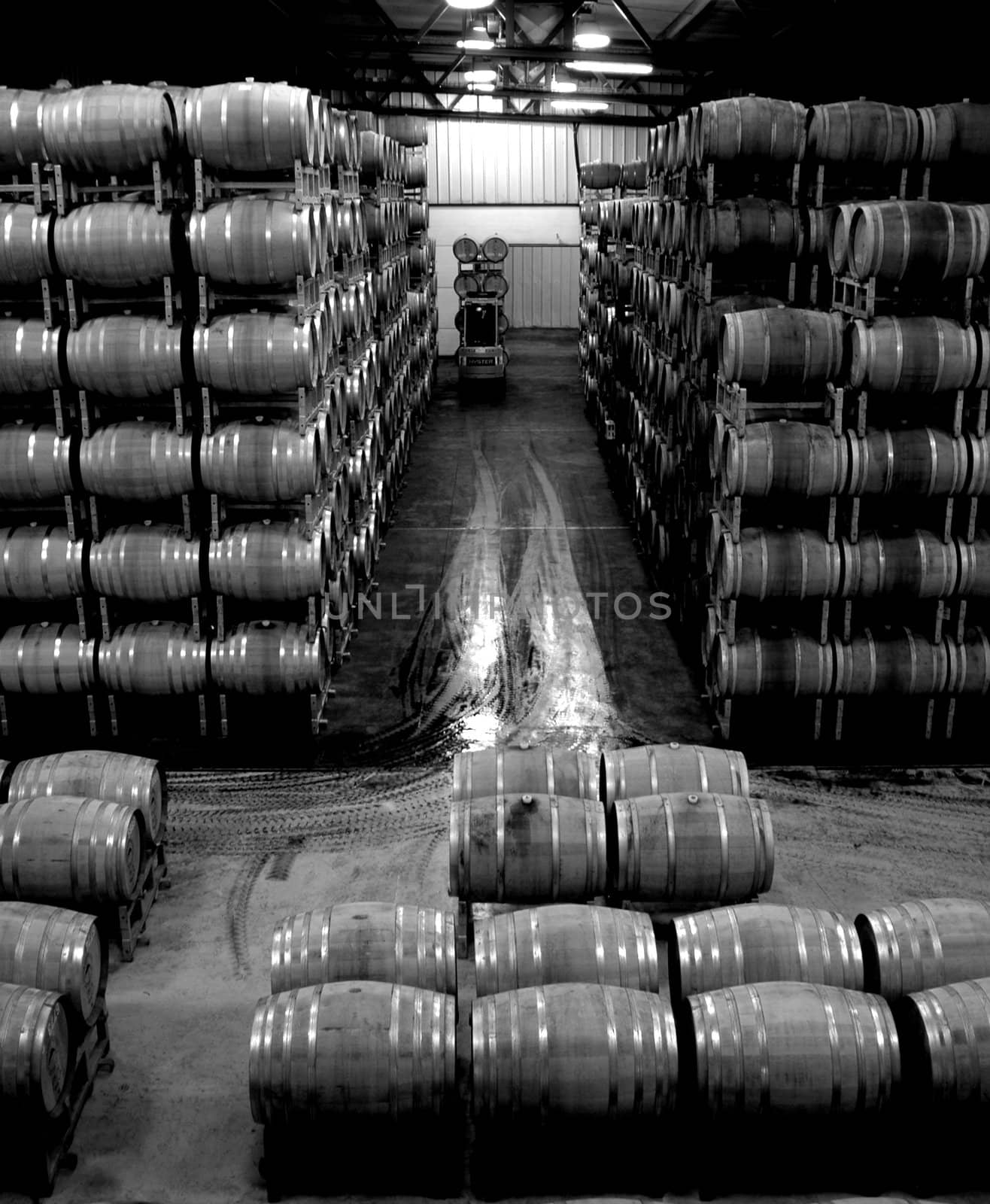 Colorful wine barrels fill the warehouse of a Napa Valley vineyard. 