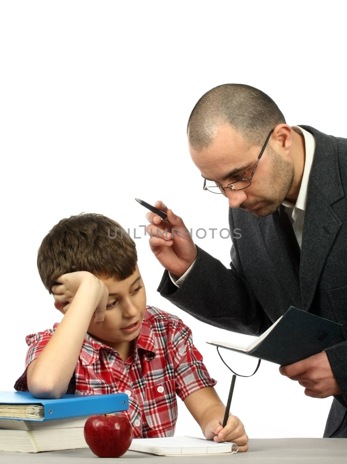 Schoolboy and teacher in classroom 