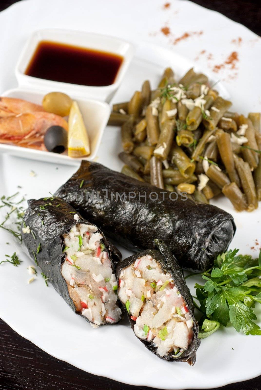 souffle of fillet of pikeperch, shrimps, crab meat, coconut and leek wrapped at nori garnished by string beans