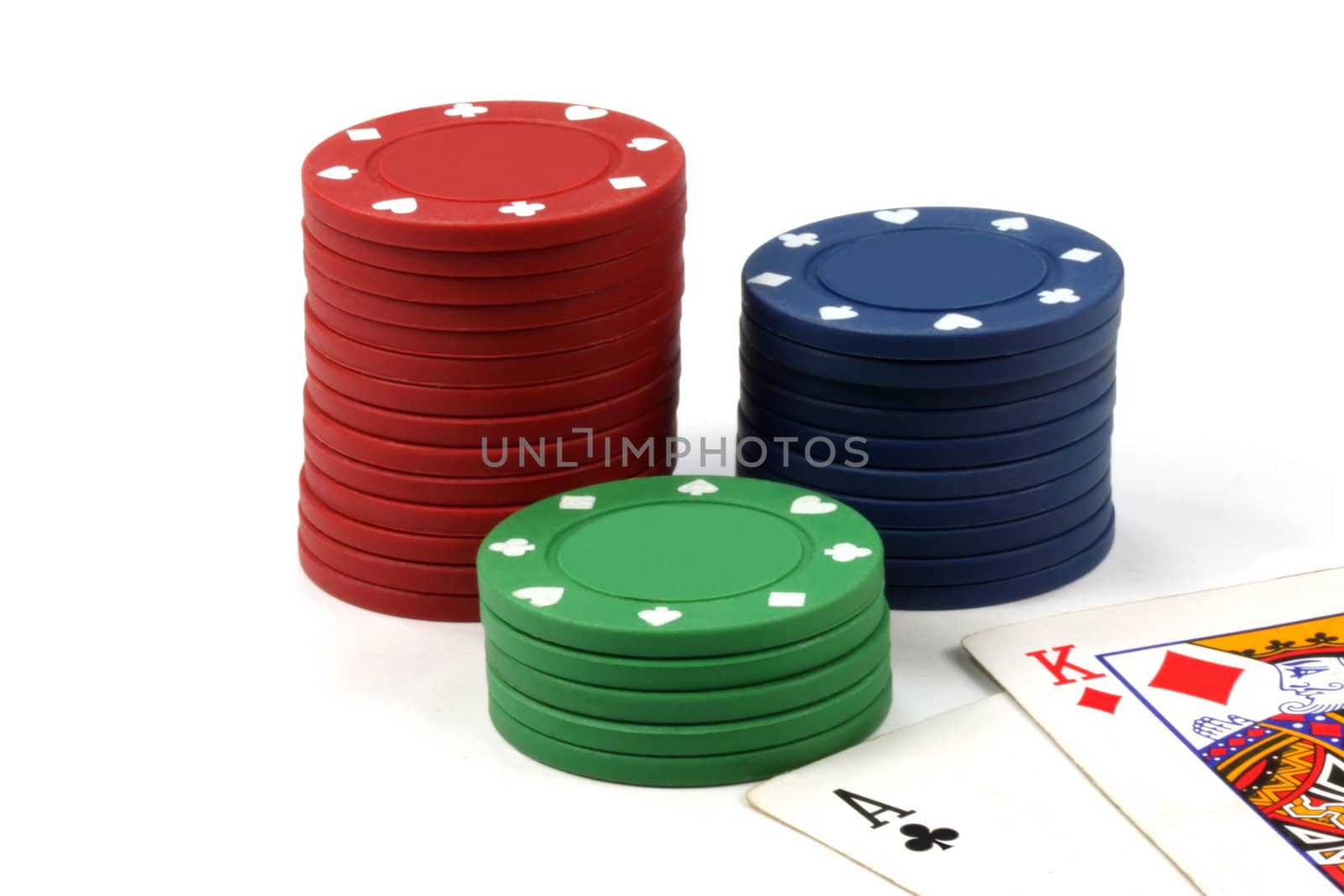 Stacked poker casino chips isolated on white background