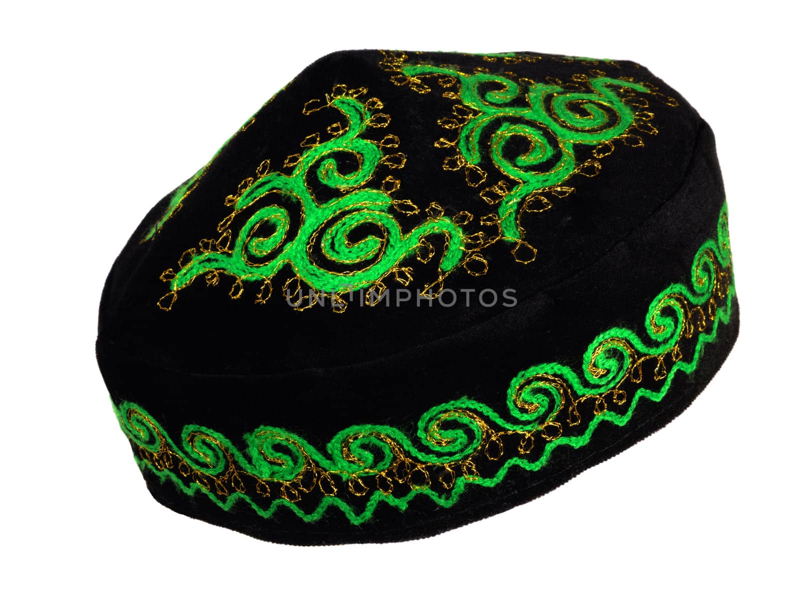 Tubeteika ( Skullcap ) - a popular headgear in the countries of Central Asia. On photo - Mongolian skullcap. Green and gold embroidery symbolizes prosperity and fertility of cattle 