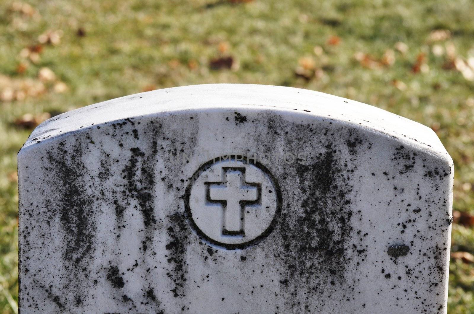 Cemetery Headstone with cross by RefocusPhoto