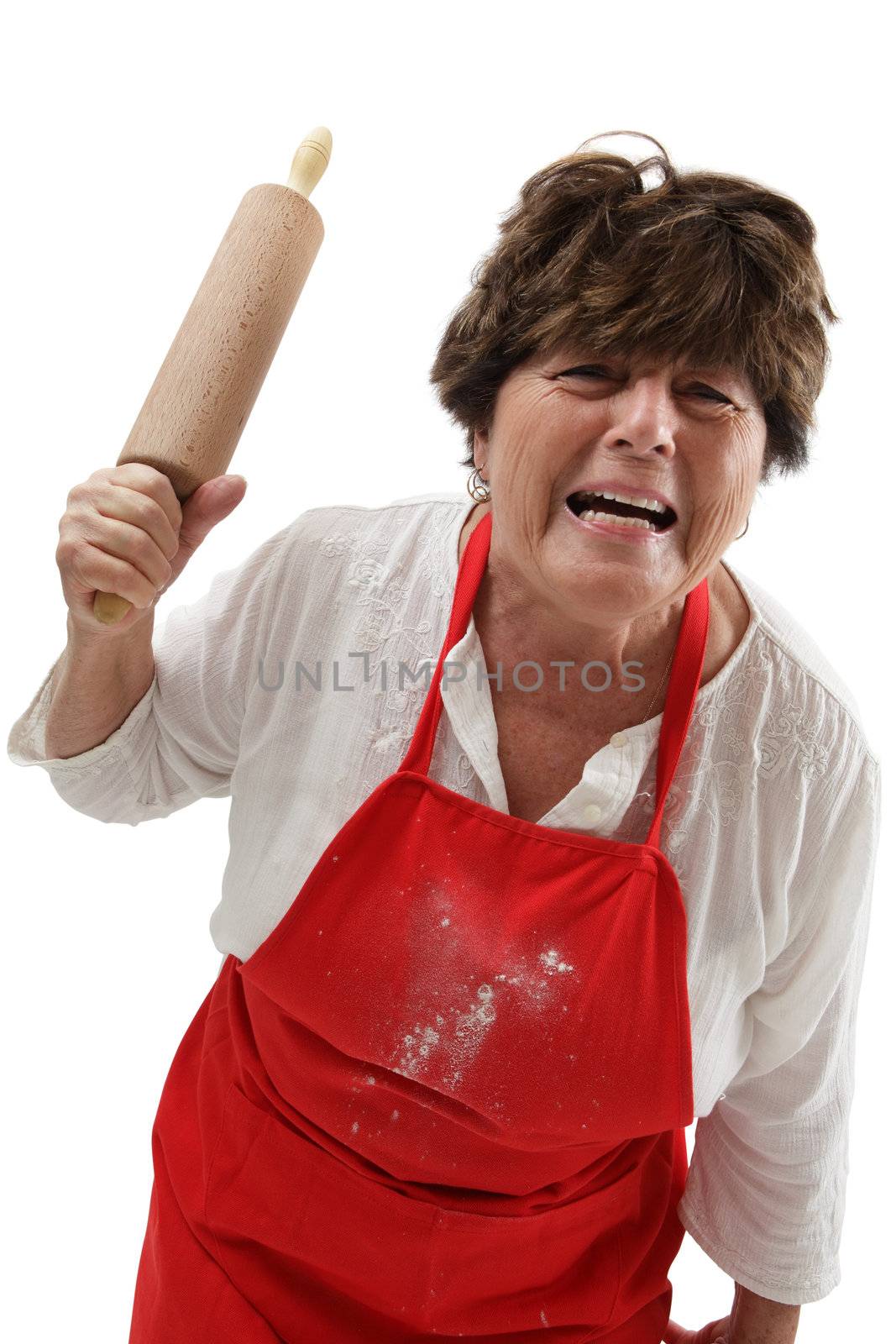 Photo of an old woman angry and threatening with a rolling pin.