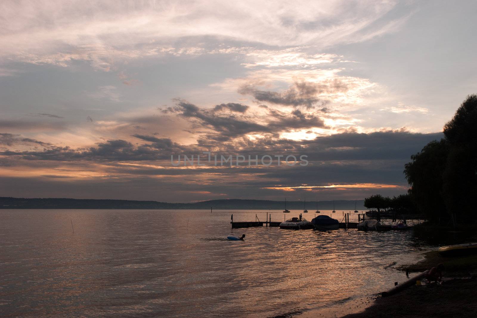 Relaxing on the seaside promenade of Obermaubach, Bodensee, Germany