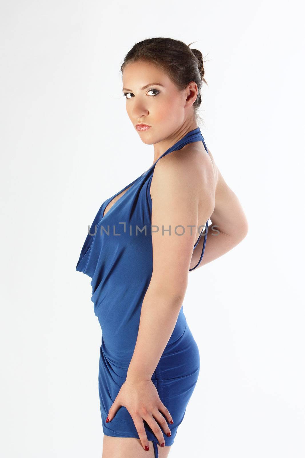 The girl in a dark blue dress on the white isolated background