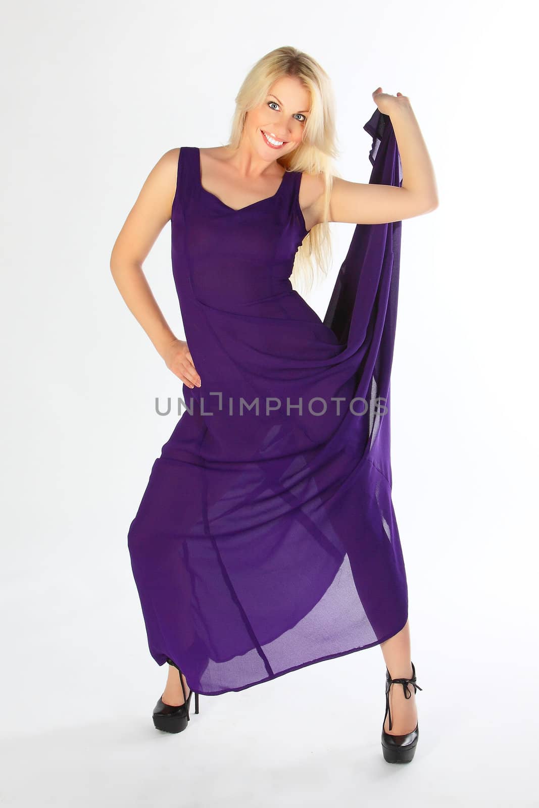 The young beautiful girl in a violet dress
