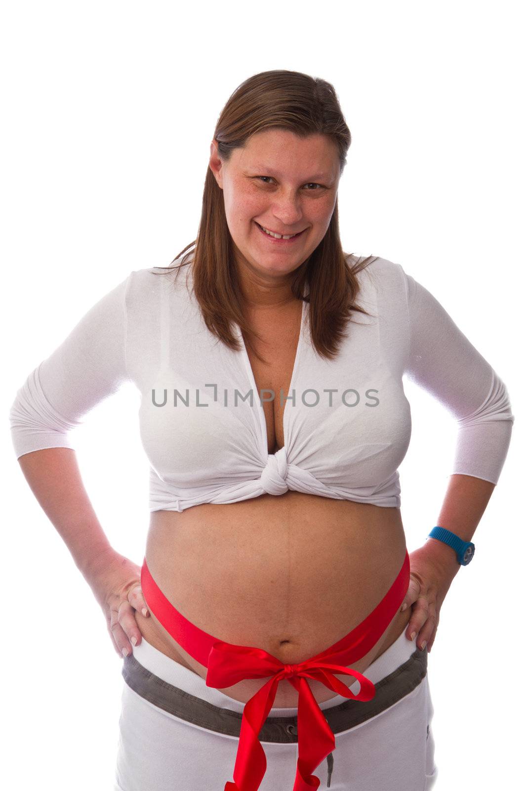 Pregnant woman with red ribbon on belly isolated on white