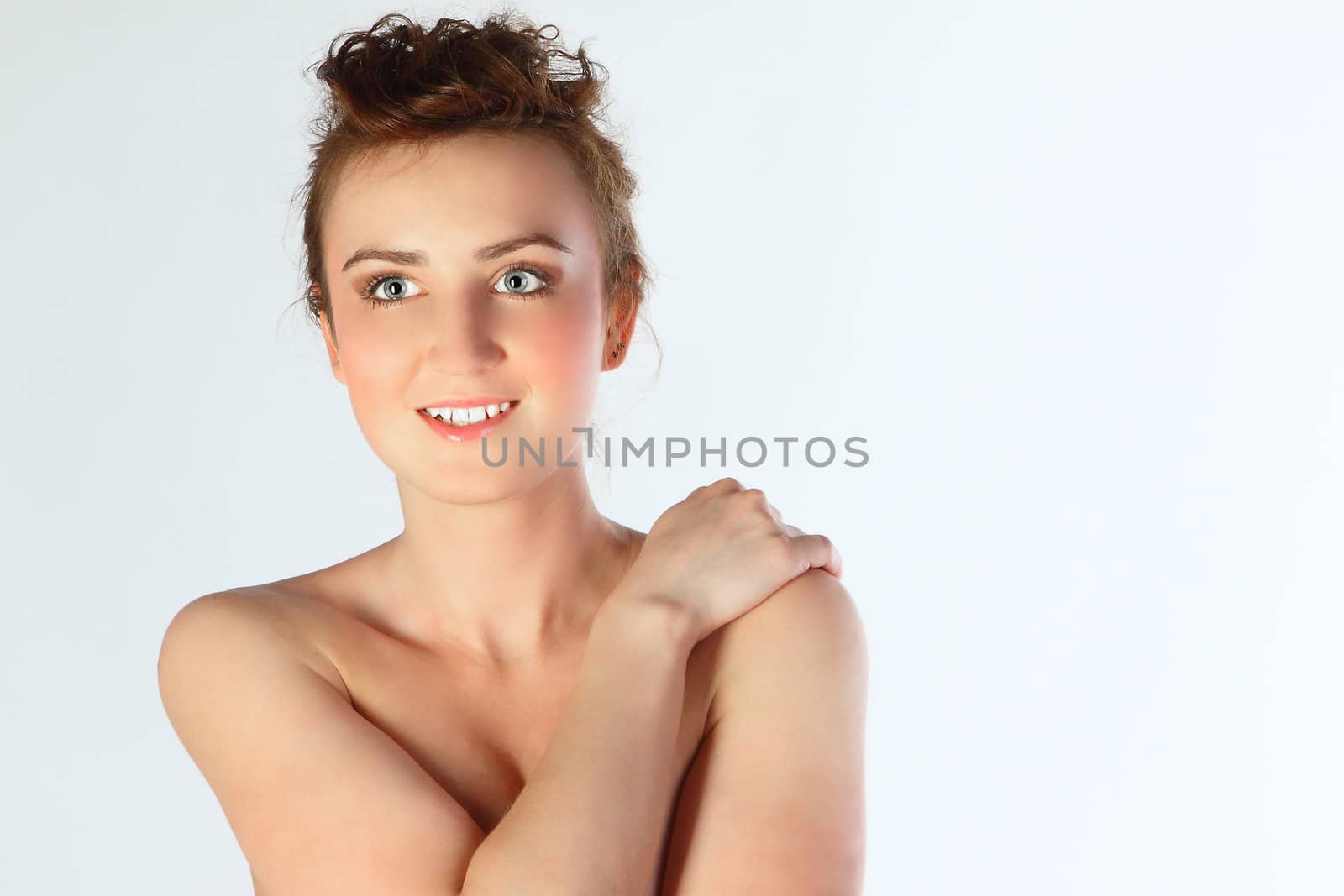 The young and beautiful girl bared on a belt
