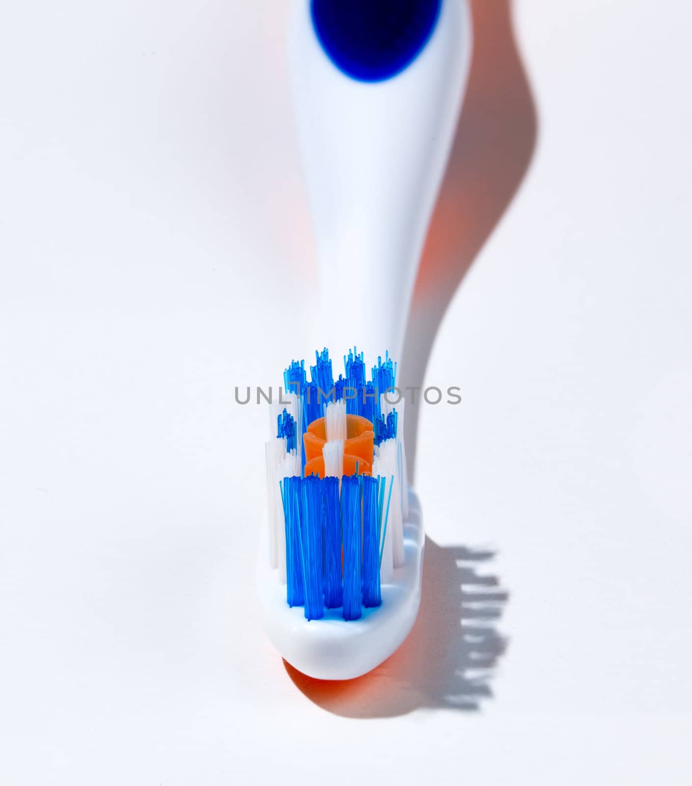 Macro image of toothbrush head with sharp bristles and out of focus handle