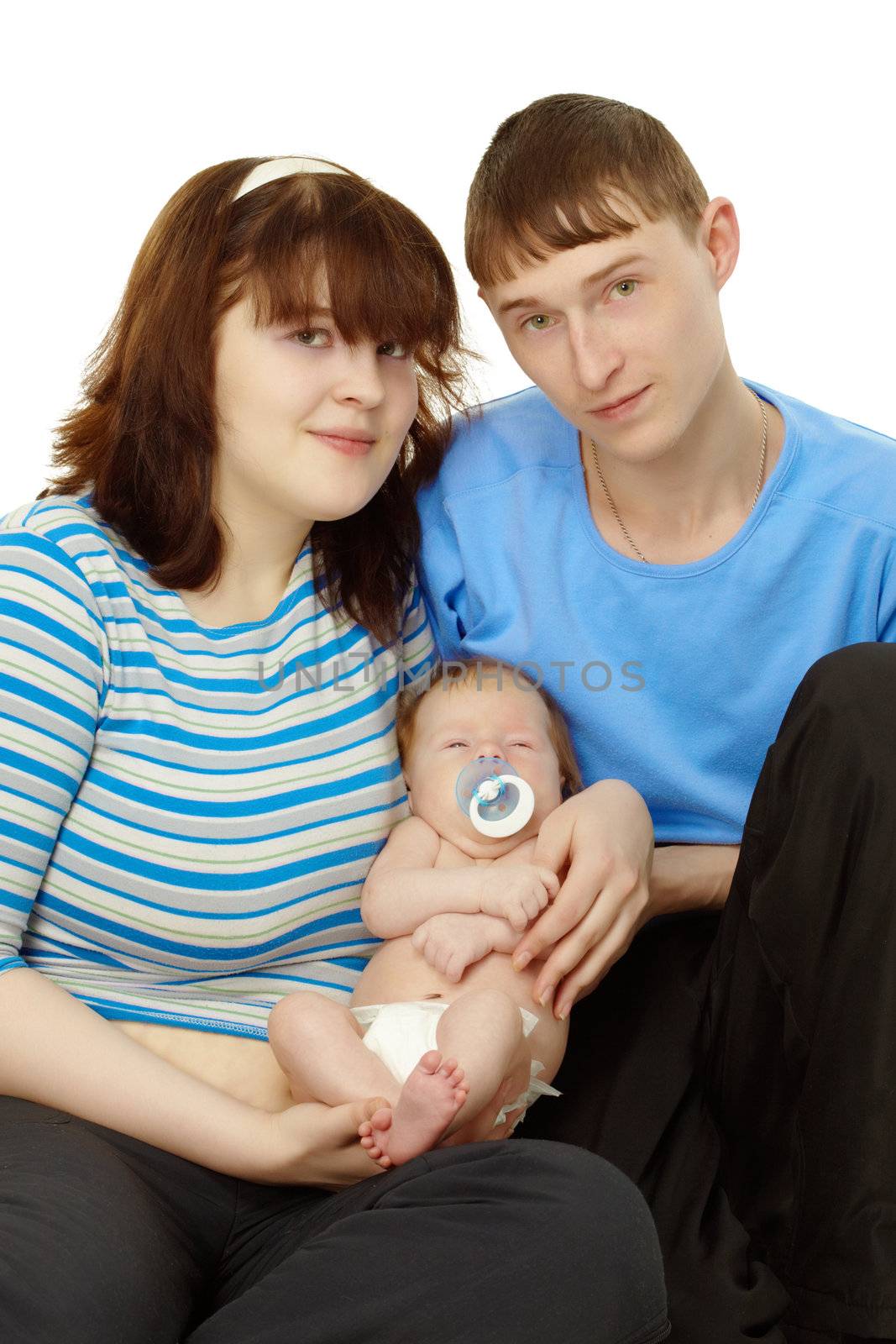 Portrait of a young family - dad, mom and baby