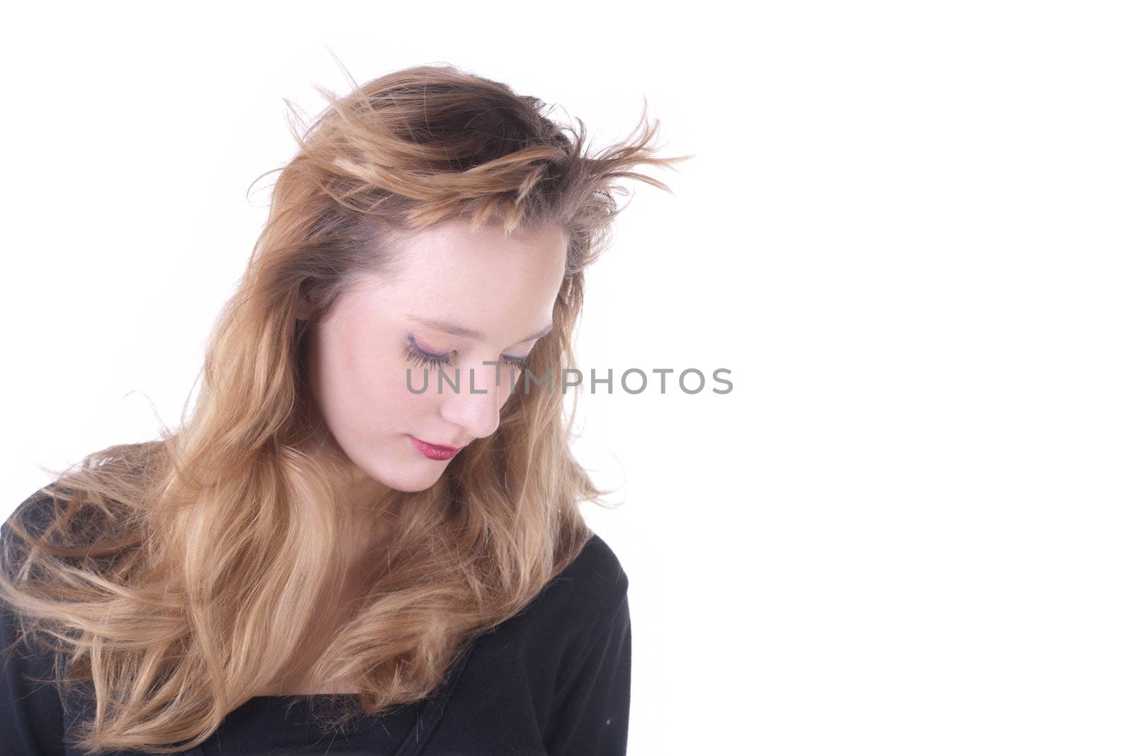 Beautiful girl with flying hair  in studio over white
