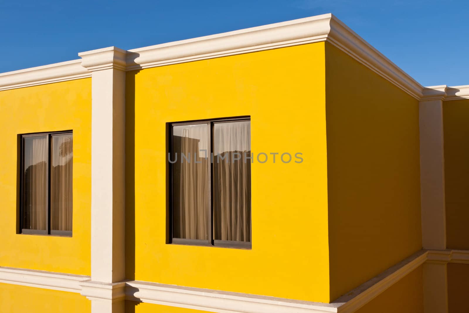 Yellow house and blue sky by dimol