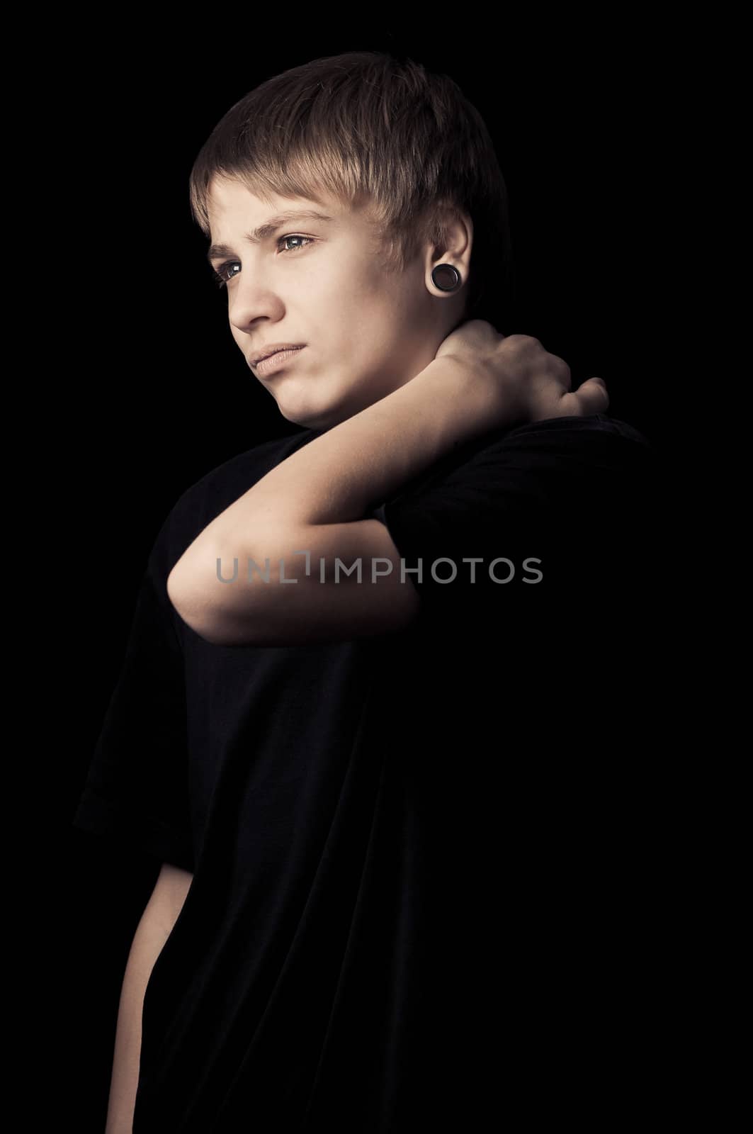 portrait of a teenager with toning on darken background