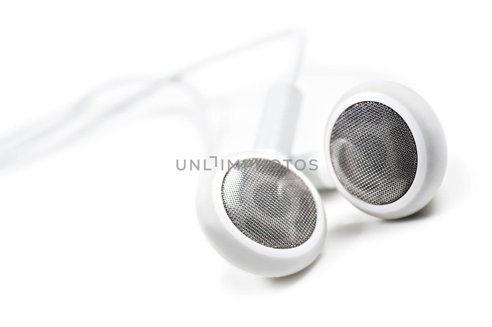 White earphones on a white background with space for text